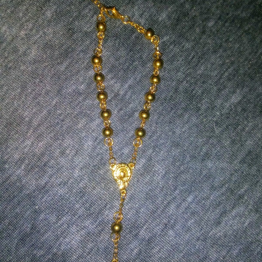 Gold colored rosary bracelet